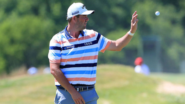 DALLAS, TX - MAY 17: Marc Leishman of Australia receives a ball from his caddie on the 10th green during the first round of the AT&T Byron Nelson at Trinity Forest Golf Club on May 17, 2018 in Dallas, Texas.