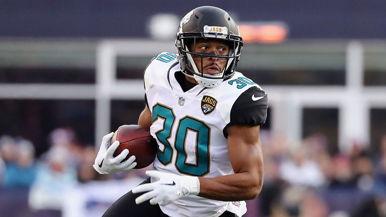 FOXBOROUGH, MA - JANUARY 21: Corey Grant #30 of the Jacksonville Jaguars carries the ball in the first quarter during the AFC Championship Game against the New England Patriots at Gillette Stadium on January 21, 2018 in Foxborough, Massachusetts.