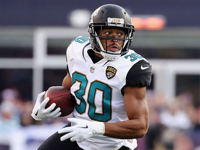 FOXBOROUGH, MA - JANUARY 21: Corey Grant #30 of the Jacksonville Jaguars carries the ball in the first quarter during the AFC Championship Game against the New England Patriots at Gillette Stadium on January 21, 2018 in Foxborough, Massachusetts.