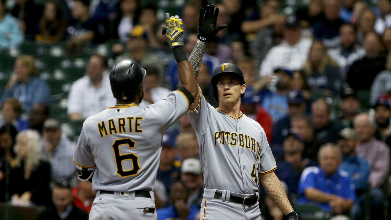 MILWAUKEE, WI - SEPTEMBER 11: Starling Marte #6 and Steven Brault #43 of the Pittsburgh Pirates celebrate after Marte hit a home run in the fifth inning against the Milwaukee Brewers at Miller Park on September 11, 2017 in Milwaukee, Wisconsin.
