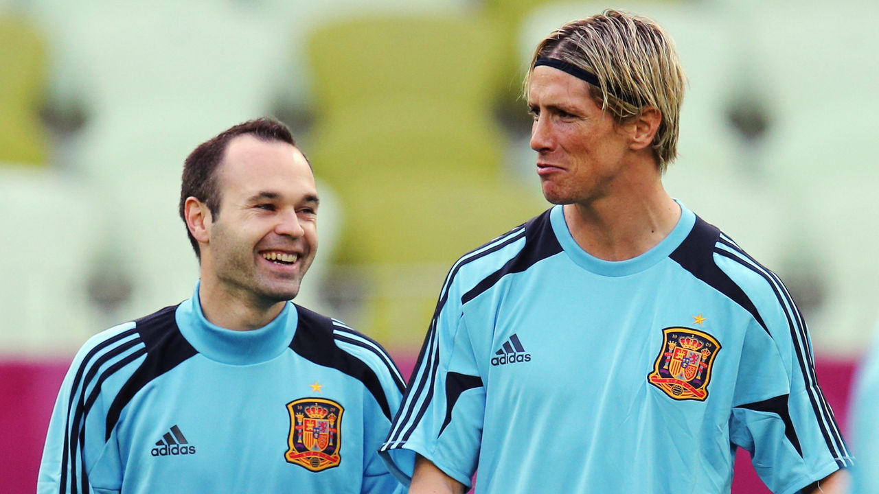 GDANSK, POLAND - JUNE 9: Andres Iniesta (L) of Spain chats with Fernando Torres during a UEFA EURO 2012 training session ahead of their Group C match against Italy at the Municipal Stadium on June 9, 2012 in Gdansk, Poland.