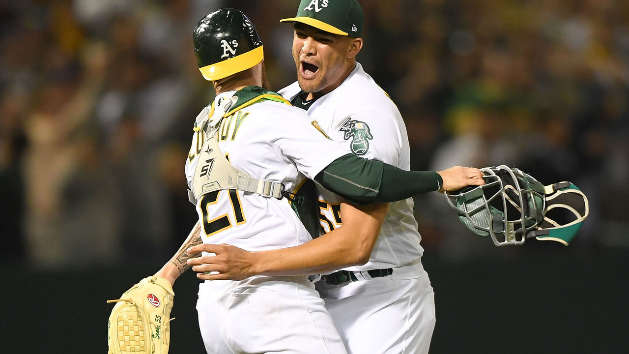 OAKLAND, CA - APRIL 21: Sean Manaea #55 and Jonathan Lucroy #21 of the Oakland Athletics celebrates after Manaea pitched a no-hitter against the Boston Red Sox at the Oakland Alameda Coliseum on April 21, 2018 in Oakland, California. The Athletics won the game 3-0.