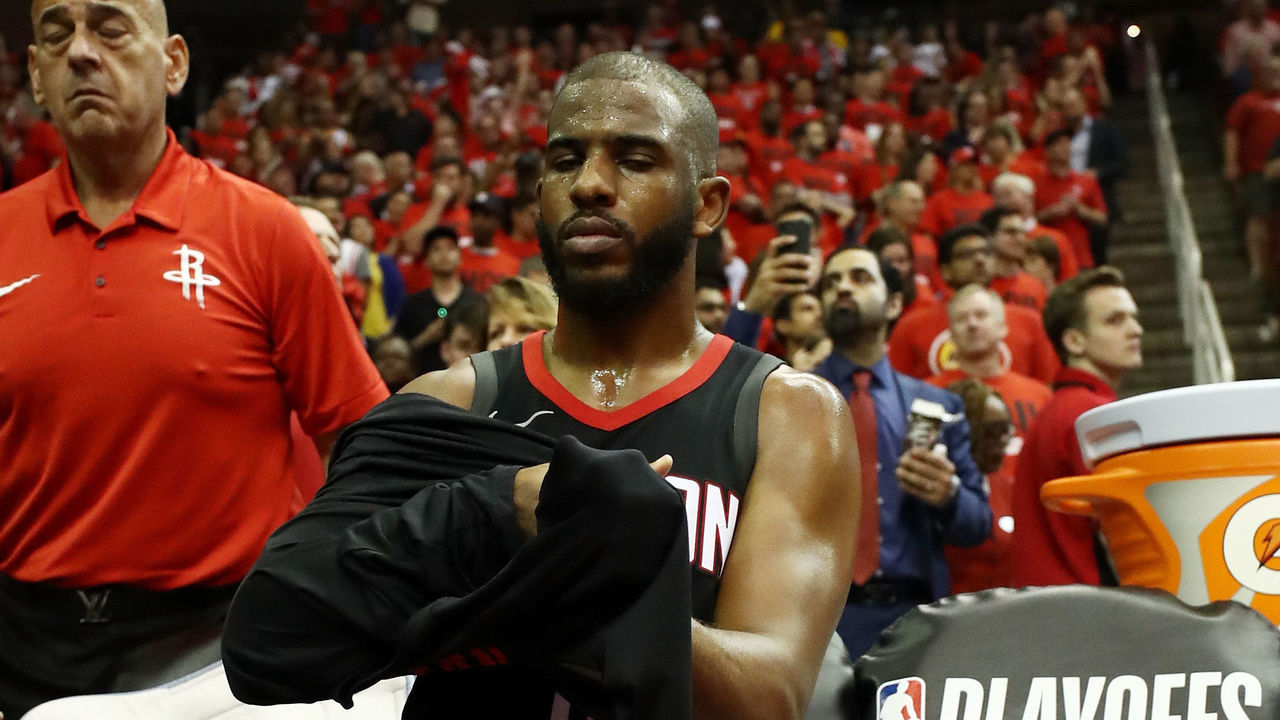 HOUSTON, TX - MAY 16: Chris Paul #3 of the Houston Rockets receives treatment on his ankle in the second half of Game Two of the Western Conference Finals of the 2018 NBA Playoffs against the Golden State Warriors at Toyota Center on May 16, 2018 in Houston, Texas.