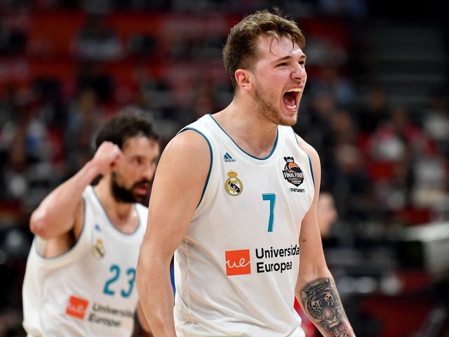 Real Madrid's Slovenian Luka Doncic (R) and Real Madrid's Spanish guard Sergio Llull react after scoring a point during the Euroleague Final Four second semi-final match between CSKA Moscow and Real Madrid at The Stark Arena in Belgrade on May 18, 2018.