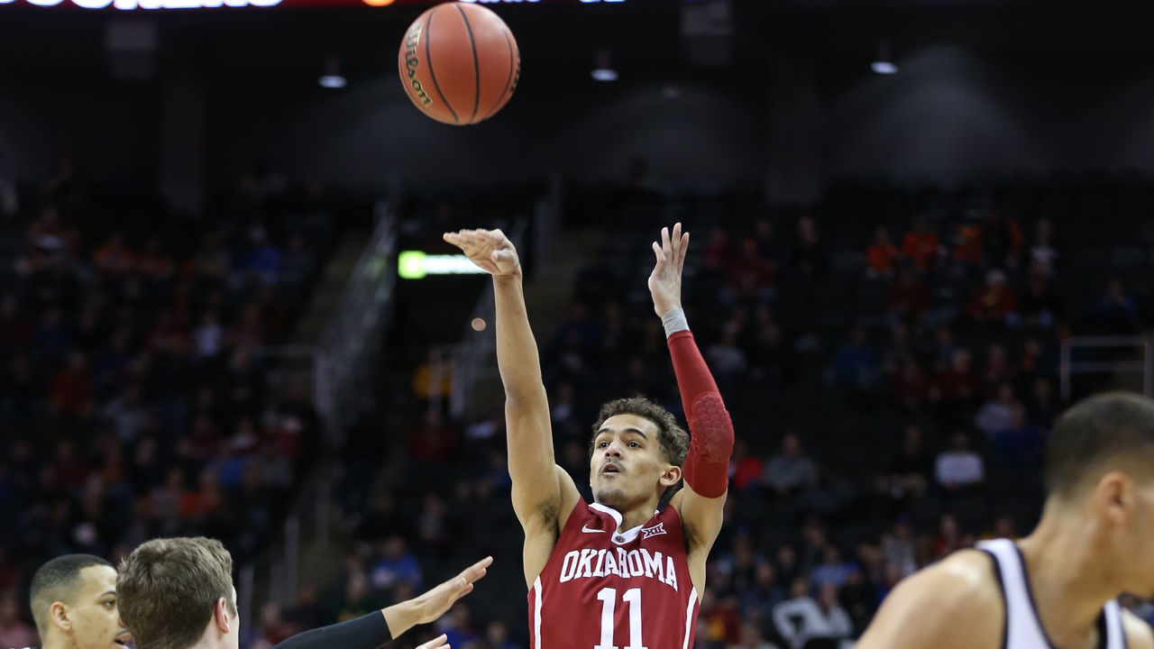 KANSAS CITY, MO - MARCH 07: Oklahoma Sooners guard Trae Young (11) shoots a three in the first half of a first round matchup in the Big 12 Basketball Championship between the Oklahoma Sooners and Oklahoma State Cowboys on March 7, 2018 at Sprint Center in Kansas City, MO.
