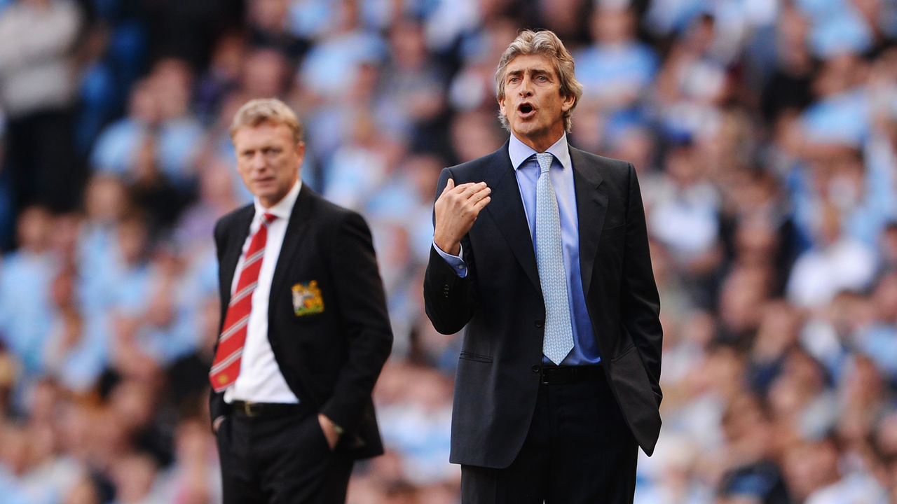MANCHESTER, ENGLAND - SEPTEMBER 22: David Moyes manager of Manchester United (L) and Manuel Pellegrini manager of Manchester City look on during the Barclays Premier League match between Manchester City and Manchester United at the Etihad Stadium on September 22, 2013 in Manchester, England.