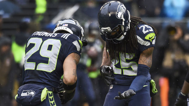 SEATTLE, WA - DECEMBER 27: Free safety Earl Thomas #29 and cornerback Richard Sherman #25 of the Seattle Seahawks play a little air guitar before the game against the St. Louis Rams at CenturyLink Field on December 27, 2015 in Seattle,Washington.