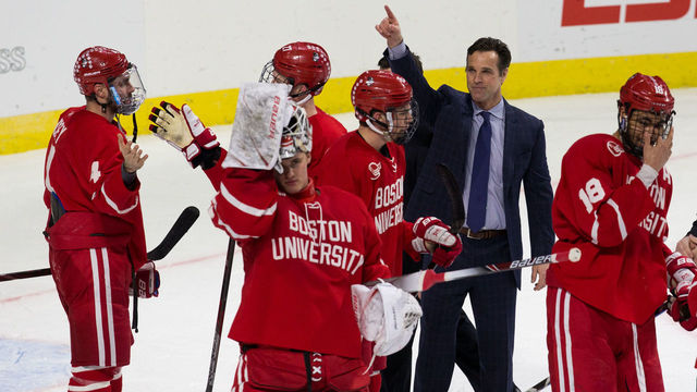 WORCESTER, MA - MARCH 24: Coach David Quinn of the Boston University Terriers celebrates a 3-1 victory against the Cornell Big Red during the NCAA Division I Men's Ice Hockey Northeast Regional Championship Semifinal at the DCU Center on March 24, 2018 in Worcester, Massachusetts.