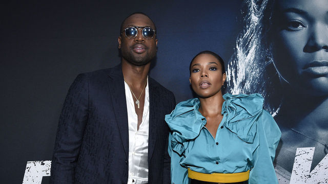 HOLLYWOOD, CA - MAY 01: Cast member Gabrielle Union and her husband basketball player for the Miami Heat Dwyane Wade arrive for Universal Pictures' special screening of the film 'Breaking In' at ArcLight Cinemas on May 1, 2018 in Hollywood, California.