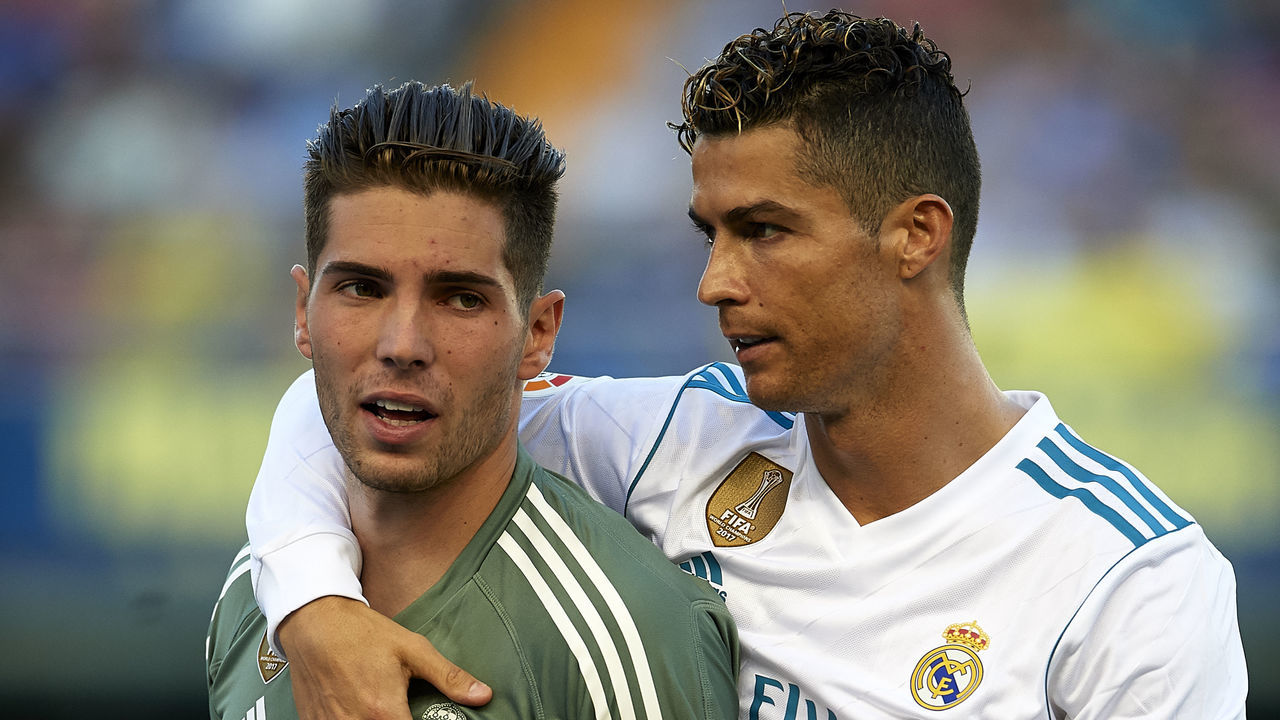 VILLARREAL, SPAIN - MAY 19: Cristiano Ronaldo (R) of Real Madrid talks to his teammate Luca Zidane prior to the La Liga match between Villarreal and Real Madrid at Estadio de La Ceramica on May 19, 2018 in Villarreal, Spain.