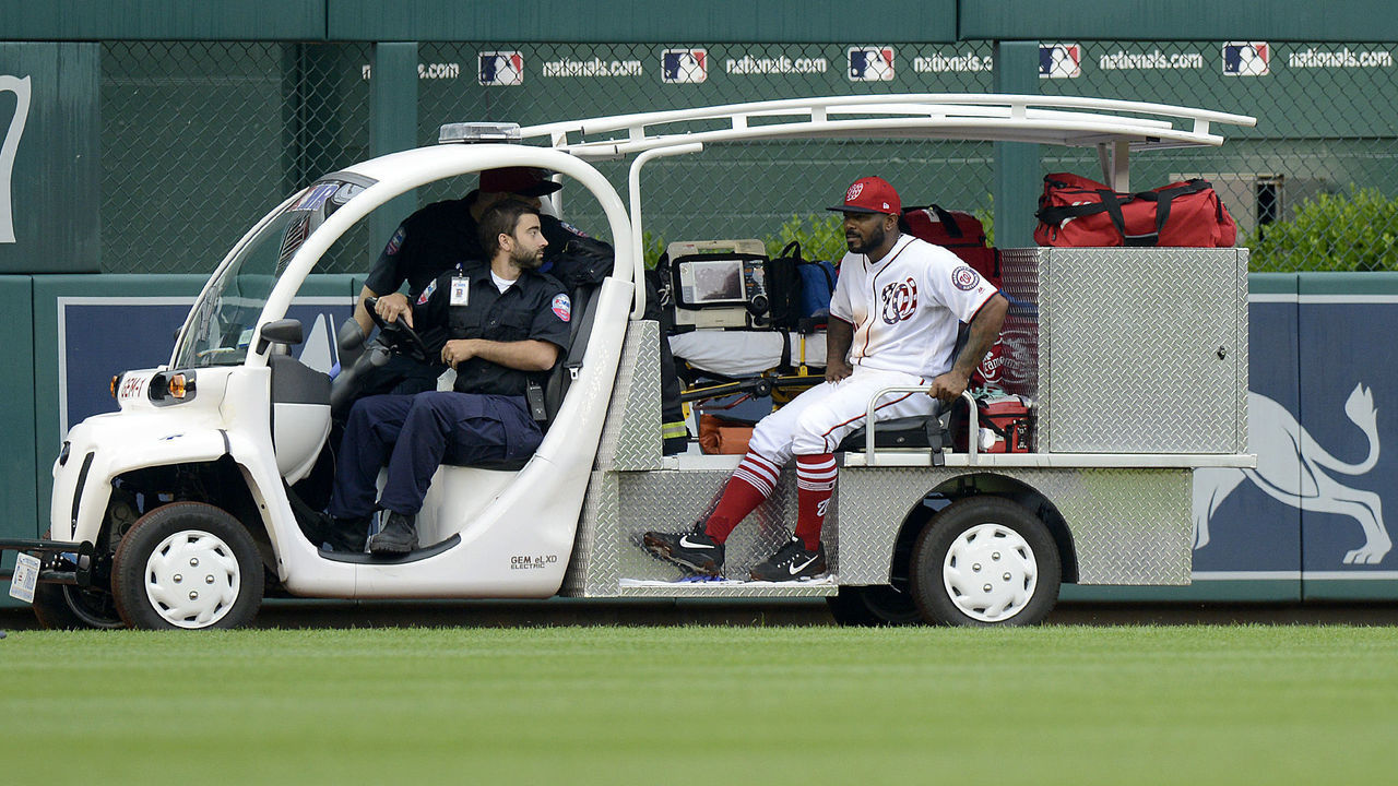 WASHINGTON, DC - MAY 19: Howie Kendrick #12 of the Washington Nationals is carted off the field after injuring his leg in the eighth inning against the Los Angeles Dodgers at Nationals Park during game one of a doubleheader on May 19, 2018 in Washington, DC.