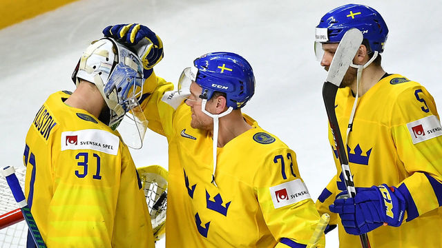 (L to R) Sweden's goalie Anders Nilsson, Sweden's Patric Hornqvist and Sweden's Mikael Wikstrand celebrate after winning the semifinal match Sweden vs USA of the 2018 IIHF Ice Hockey World Championship at the Royal Arena in Copenhagen, Denmark, on May 19, 2018.