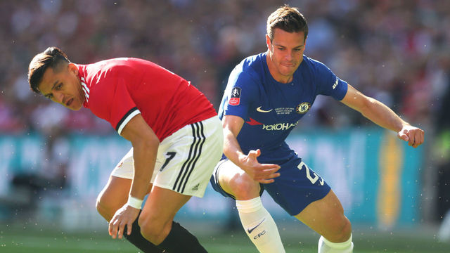 LONDON, ENGLAND - MAY 19: Cesar Azpilicueta of Chelsea runs with the ball past Alexis Sanchez of Manchester United during The Emirates FA Cup Final between Chelsea and Manchester United at Wembley Stadium on May 19, 2018 in London, England.