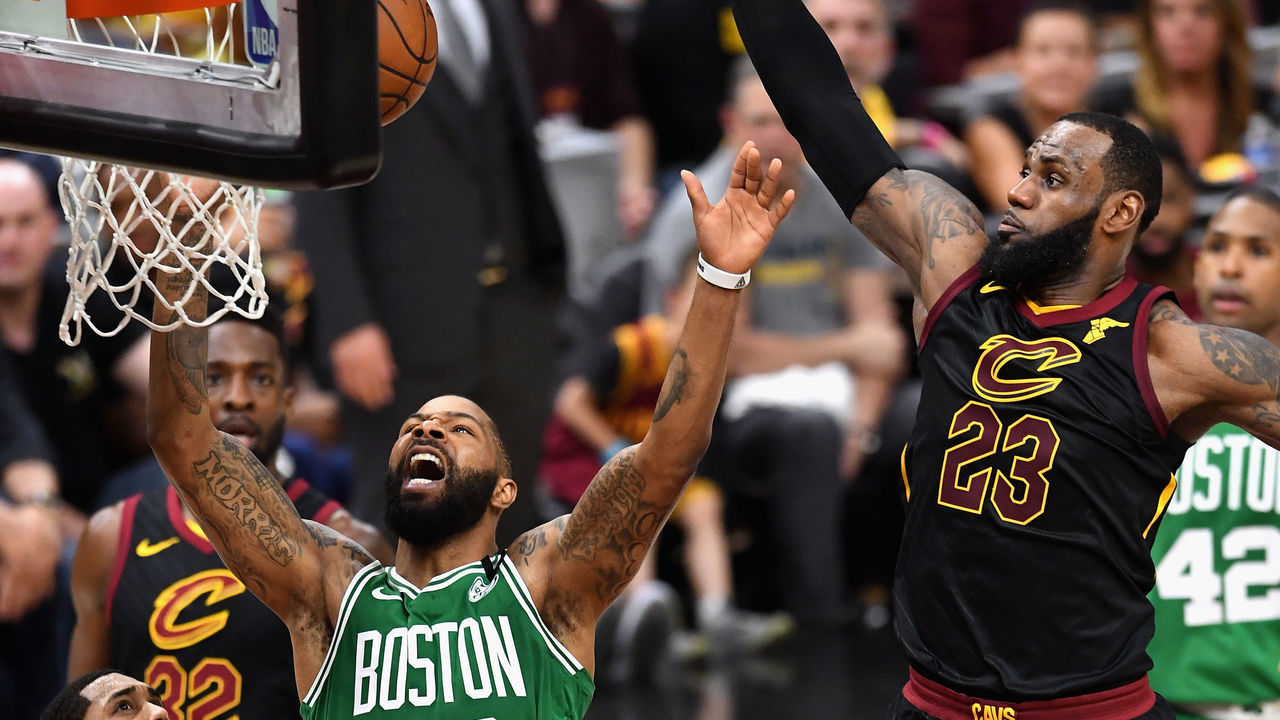CLEVELAND, OH - MAY 19: Marcus Morris #13 of the Boston Celtics battles for the ball with LeBron James #23 of the Cleveland Cavaliers in the first half during Game Three of the 2018 NBA Eastern Conference Finals at Quicken Loans Arena on May 19, 2018 in Cleveland, Ohio.