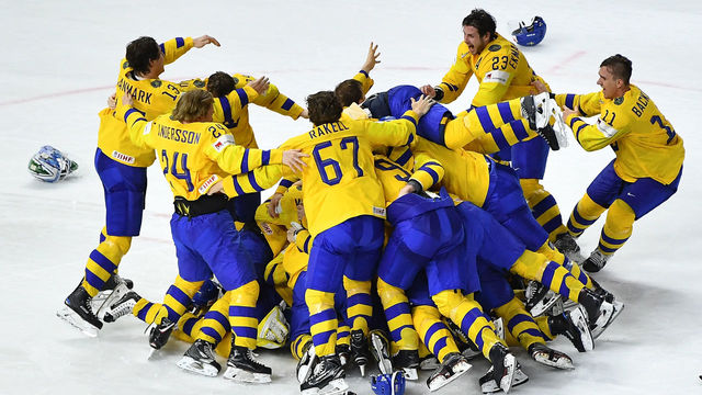 Sweden's players celebrate after the final match Sweden vs Switzerland of the 2018 IIHF Ice Hockey World Championship at the Royal Arena in Copenhagen, Denmark, on May 20, 2018.