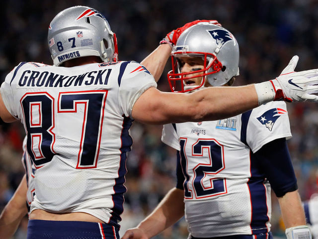 MINNEAPOLIS, MN - FEBRUARY 04: Rob Gronkowski #87 and Tom Brady #12 of the New England Patriots celebrate their 4-yard touchdown pass during the fourth quarter against the Philadelphia Eagles in Super Bowl LII at U.S. Bank Stadium on February 4, 2018 in Minneapolis, Minnesota.