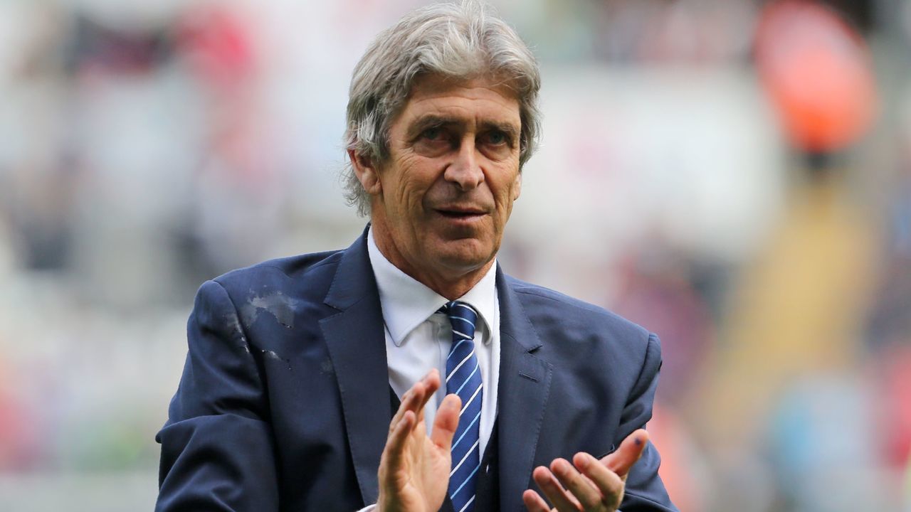 Manchester City's Chilean manager Manuel Pellegrini applauds on the pitch after the English Premier League football match between Swansea City and Manchester City at The Liberty Stadium in Swansea, south Wales on May 15, 2016. The game finished 1-1. / AFP / GEOFF CADDICK /