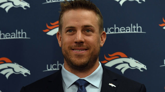 ENGLEWOOD, CO MARCH 16: Denver Broncos quarterback Case Keenum and John Elway, general manager and executive vice president of football operations of the Denver Broncos pose with his jersey during a press conference on March 16, 2018 at Dove Valley. Case Keenum agreed to terms on a two-year deal with the Denver Broncos.