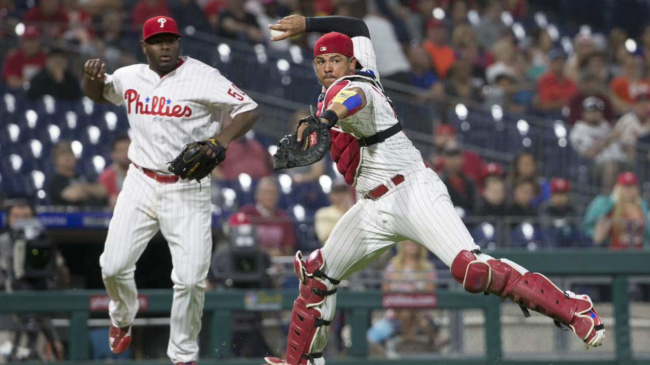 PHILADELPHIA, PA - MAY 21: Jorge Alfaro #38 of the Philadelphia Phillies throws the ball to first base to make the final out of the game on a ball hit by Ender Inciarte #11 of the Atlanta Braves as Hector Neris looks on on at Citizens Bank Park on May 21, 2018 in Philadelphia, Pennsylvania. The Phillies defeated the Braves 3-0.