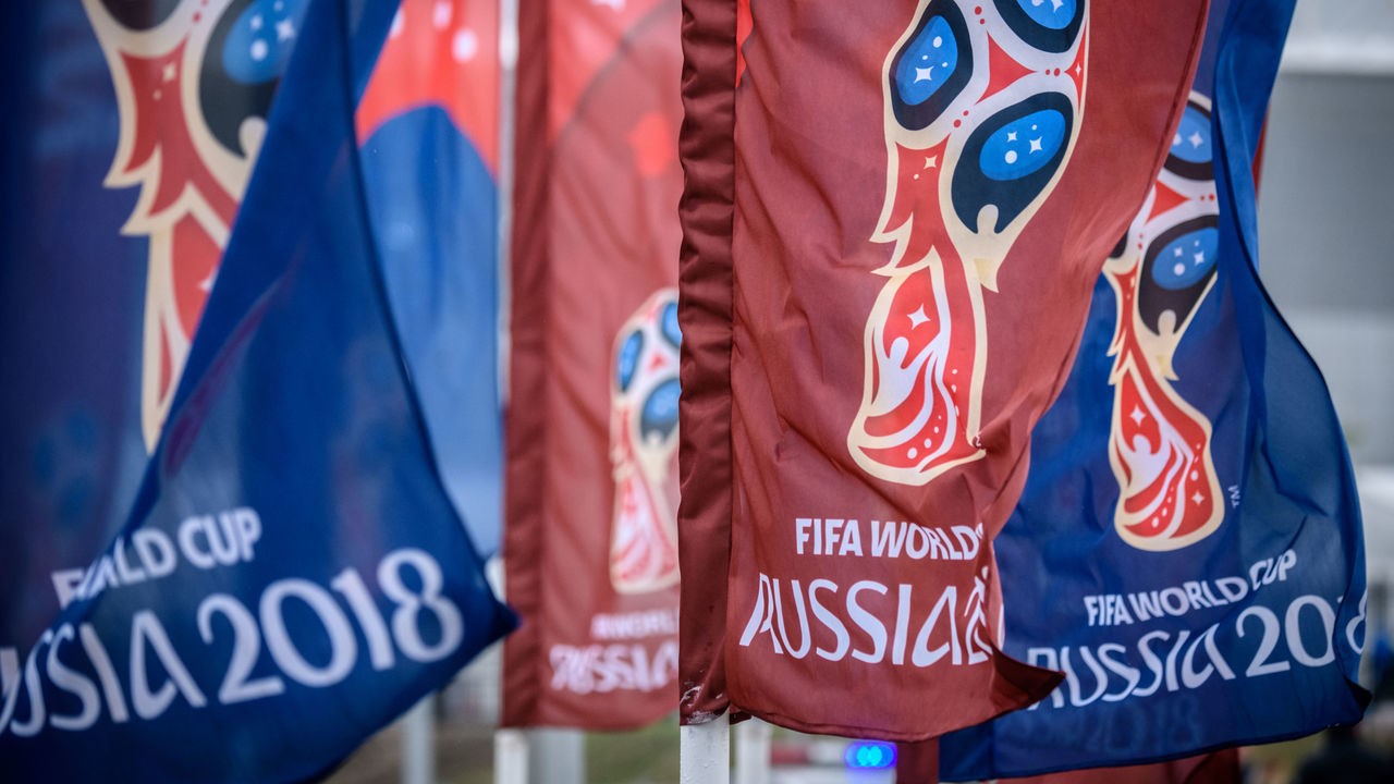 Flags featuring the logo of the FIFA World Cup 2018 are seen outside Rostov Arena in the southern Russian city of Rostov-on-Don on May 13, 2018. - The Rostov Arena will host five football matches of the 2018 FIFA World Cup.