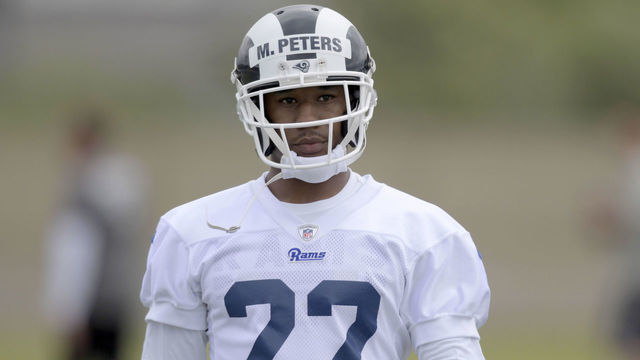 Rams' Peters carted to locker room with ankle injury