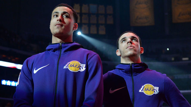 LOS ANGELES, CA - MARCH 13: Lonzo Ball #2 and Kyle Kuzma #0 of the Los Angeles Lakers stand for the National Anthem before the game against the Denver Nuggets on March 13, 2018 at STAPLES Center in Los Angeles, California. NOTE TO USER: User expressly acknowledges and agrees that, by downloading and/or using this Photograph, user is consenting to the terms and conditions of the Getty Images License Agreement. Mandatory Copyright Notice: Copyright 2018 NBAE