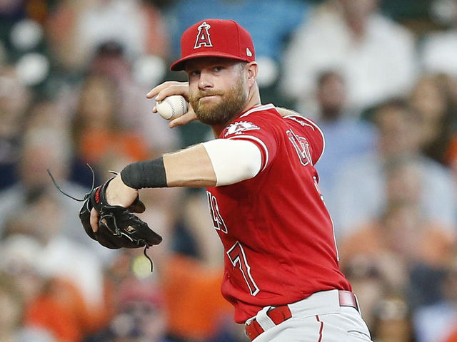 HOUSTON, TX - APRIL 25: Zack Cozart #7 of the Los Angeles Angels of Anaheim fields a hard hit ball by Alex Bregman #2 of the Houston Astros in the second inning at Minute Maid Park on April 25, 2018 in Houston, Texas.