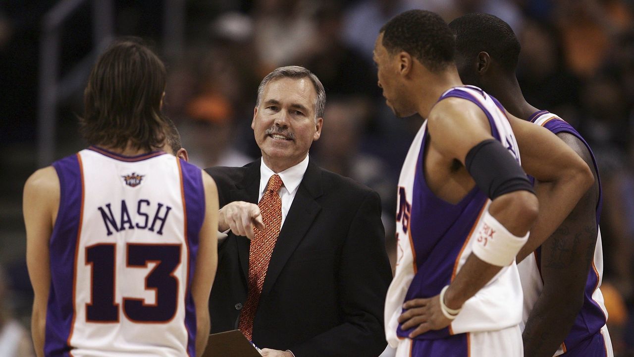 PHOENIX - APRIL 13: (L-R) Steve Nash #13 of the Phoenix Suns discusses a play with head coach Mike D'Antoni, Shawn Marion #31 and Tim Thomas #2 during a time out in the second half of the game against the Dallas Mavericks at the US Airways Center on April 13, 2006 in Phoenix, Arizona. The Suns defeated the Mavs 117-104. NOTE TO USER: User expressly acknowledges and agrees that, by downloading and/or using this Photograph, user is consenting to the terms and conditions of the Getty Images License Agreement.