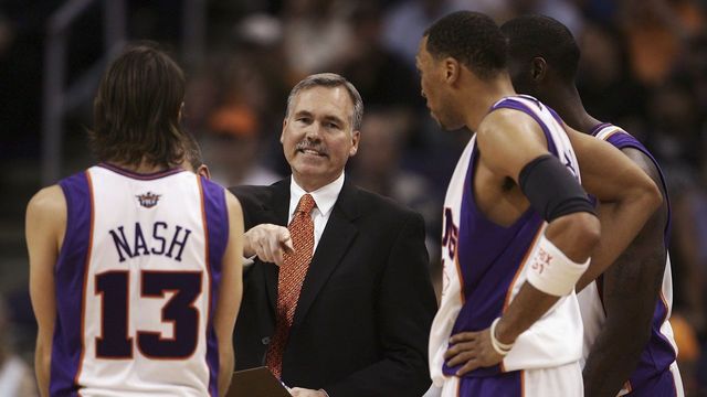 PHOENIX - APRIL 13: (L-R) Steve Nash #13 of the Phoenix Suns discusses a play with head coach Mike D'Antoni, Shawn Marion #31 and Tim Thomas #2 during a time out in the second half of the game against the Dallas Mavericks at the US Airways Center on April 13, 2006 in Phoenix, Arizona. The Suns defeated the Mavs 117-104. NOTE TO USER: User expressly acknowledges and agrees that, by downloading and/or using this Photograph, user is consenting to the terms and conditions of the Getty Images License Agreement.