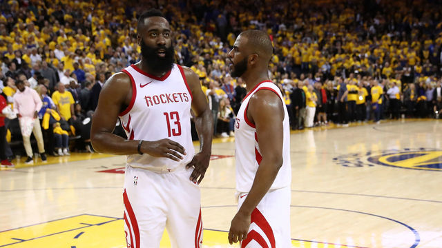 OAKLAND, CA - MAY 22: James Harden #13 and Chris Paul #3 of the Houston Rockets stand on the court as the officials review a play at the end of Game Four of the Western Conference Finals of the 2018 NBA Playoffs at ORACLE Arena on May 22, 2018 in Oakland, California.