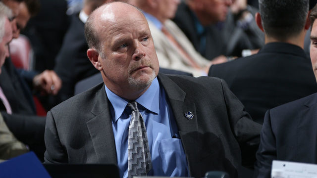 SUNRISE, FL - JUNE 26: Director of Player Personnel of the Toronto Maple Leafs Mark Hunter looks on from the Leafs' draft table during Round One of the 2015 NHL Draft at BB&T Center on June 26, 2015 in Sunrise, Florida.