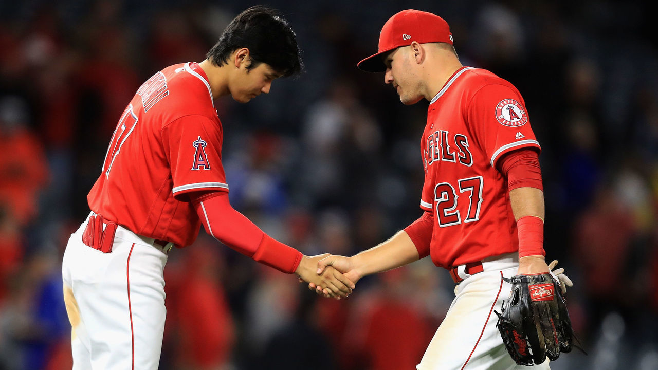ANAHEIM, CA - MAY 10: Shohei Ohtani #17 shakes hands with Mike Trout #27 of the Los Angeles Angels of Anaheim after defeating the Minnesota Twins 7-4 in a game at Angel Stadium on May 10, 2018 in Anaheim, California.
