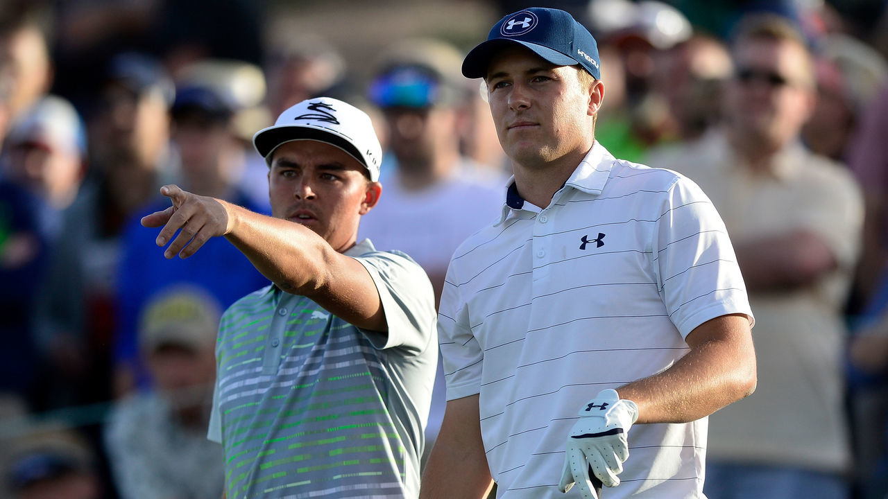 SCOTTSDALE, AZ - FEBRUARY 03: Rickie Fowler(left) shows Jordan Spieth where his tee shot went into the water hazard on the 18th hole during the second round of the Waste Management Phoenix Open at TPC Scottsdale on February 3, 2017 in Scottsdale, Arizona.