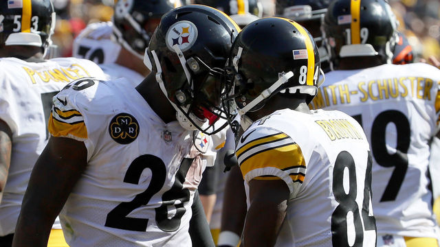 CHICAGO, IL - SEPTEMBER 24: Le'Veon Bell #26 and Antonio Brown #84 of the Pittsburgh Steelers celebrate after Bell scored in the third quarter against the Chicago Bears at Soldier Field on September 24, 2017 in Chicago, Illinois.