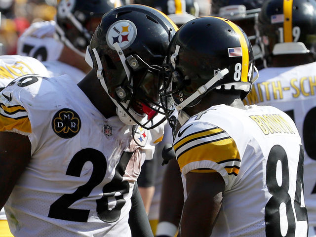 CHICAGO, IL - SEPTEMBER 24: Le'Veon Bell #26 and Antonio Brown #84 of the Pittsburgh Steelers celebrate after Bell scored in the third quarter against the Chicago Bears at Soldier Field on September 24, 2017 in Chicago, Illinois.