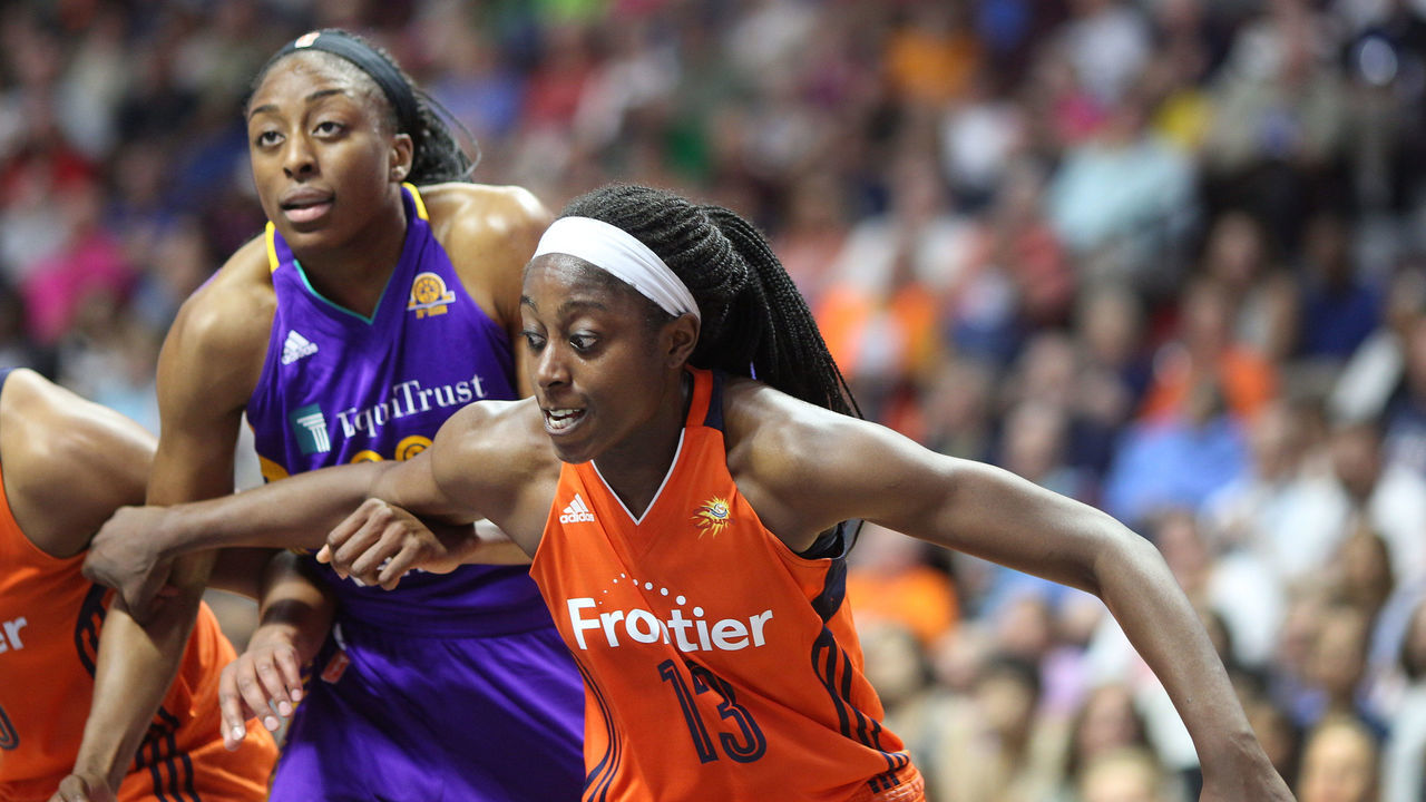 UNCASVILLE, CONNECTICUT- JULY 15: Sisters Nneka Ogwumike #30 of the Los Angeles Sparks and Chiney Ogwumike #13 of the Connecticut Sun in action during the Los Angeles Sparks Vs Connecticut Sun, WNBA regular season game at Mohegan Sun Arena on July 15, 2016 in Uncasville, Connecticut.
