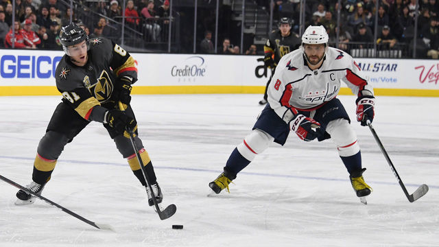 LAS VEGAS, NV - DECEMBER 23: Jonathan Marchessault #81 of the Vegas Golden Knights passes under pressure from Alex Ovechkin #8 of the Washington Capitals during the second period of their game at T-Mobile Arena on December 23, 2017 in Las Vegas, Nevada. The Golden Knights won 3-0.