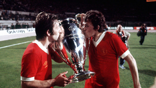 (L-R) Liverpool's Jimmy Case and Phil Neal, who scored the final goal, kiss the European Cup