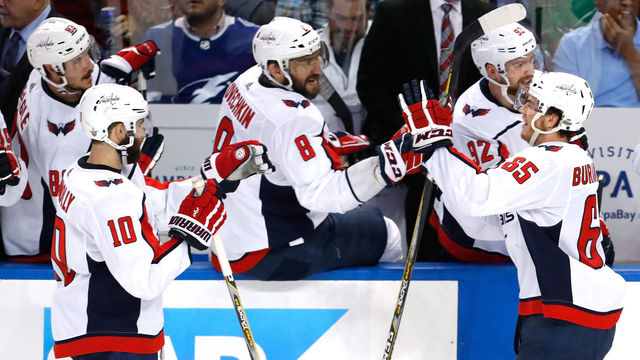 TAMPA, FL - MAY 23: Andre Burakovsky #65 of the Washington Capitals celebrates with his teammate Alex Ovechkin #8 after scoring a goal against Andrei Vasilevskiy #88 of the Tampa Bay Lightning during the second period in Game Seven of the Eastern Conference Finals during the 2018 NHL Stanley Cup Playoffs at Amalie Arena on May 23, 2018 in Tampa, Florida.