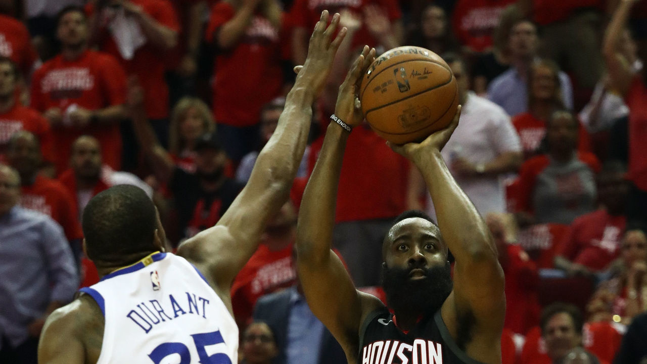 HOUSTON, TX - MAY 24: James Harden #13 of the Houston Rockets shoots against Kevin Durant #35 of the Golden State Warriors in the first half of Game Five of the Western Conference Finals of the 2018 NBA Playoffs at Toyota Center on May 24, 2018 in Houston, Texas.