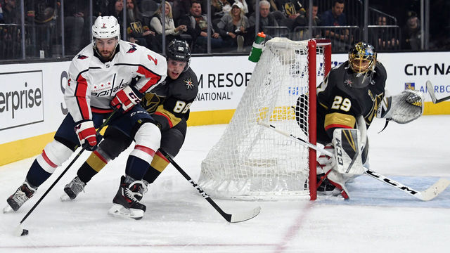 LAS VEGAS, NV - DECEMBER 23: Matt Niskanen #2 of the Washington Capitals skates against Nate Schmidt #88 of the Vegas Golden Knights behind the net as Marc-Andre Fleury #29 of the Golden Knights looks on during the third period of their game at T-Mobile Arena on December 23, 2017 in Las Vegas, Nevada. The Golden Knights won 3-0.