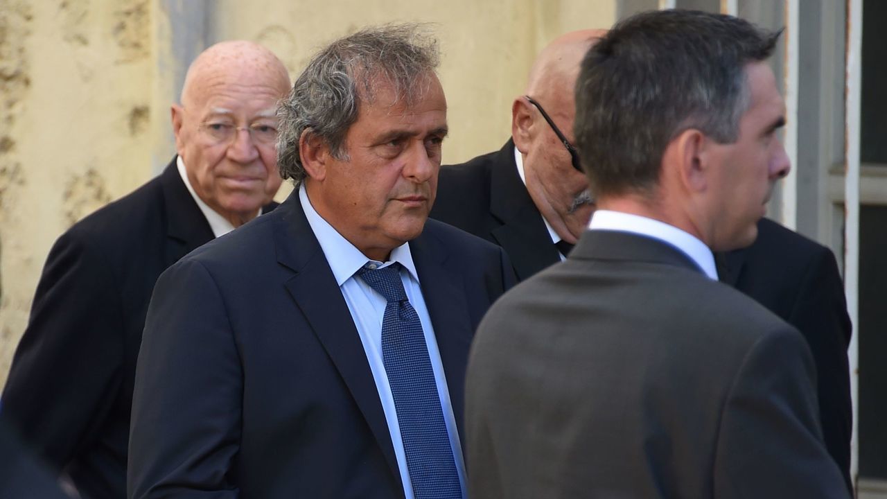 French former football player and former UEFA head Michel Platini (C) arrives for the funeral ceremony of late Montpellier's President Louis Nicollin, on July 4, 2017, at the Cathedral of Saint-Pierre in Montpellier. French industrialist Louis Nicollin, the iconic president of Montpellier and the Ligue 1 side's founding father, died on June 29 as he celebrated his 74th birthday. / AFP PHOTO / SYLVAIN THOMAS
