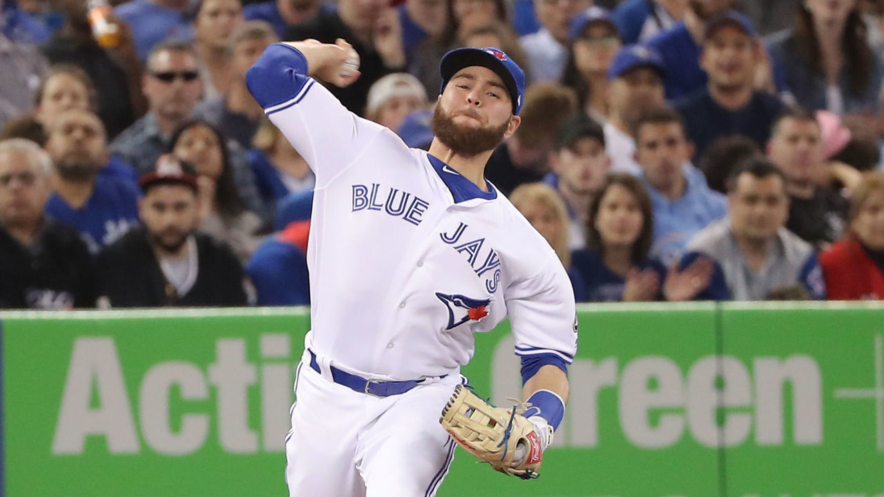 TORONTO, ON - MAY 12: Russell Martin #55 of the Toronto Blue Jays makes the play and throws out the baserunner in the fifth inning during MLB game action against the Boston Red Sox at Rogers Centre on May 12, 2018 in Toronto, Canada.