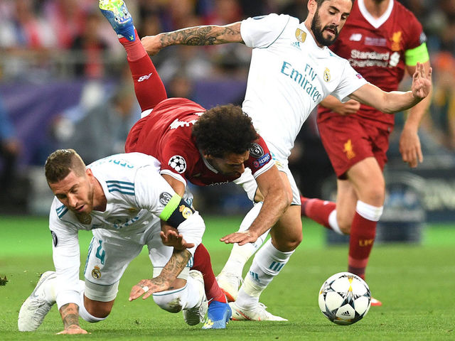 KIEV, UKRAINE - MAY 26: Mohamed Salah of Liverpool falls and lands on his shoulder after a collision with Sergio Ramos of Real Madrid, leading to him going off injured during the UEFA Champions League Final between Real Madrid and Liverpool at NSC Olimpiyskiy Stadium on May 26, 2018 in Kiev, Ukraine.