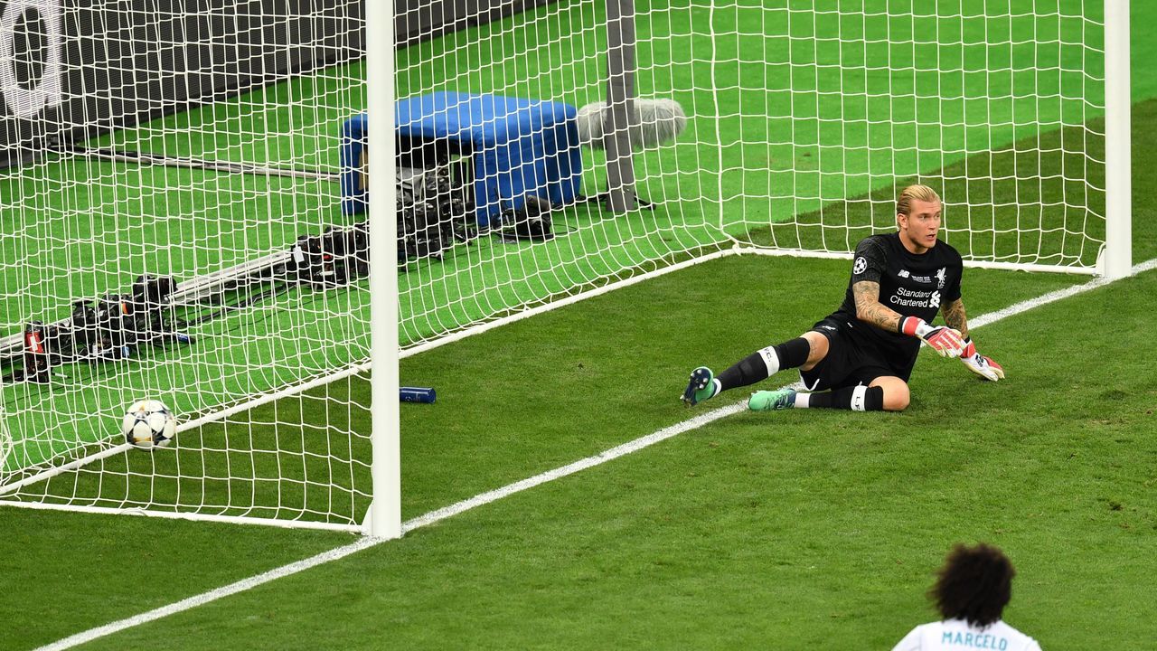 TOPSHOT - Liverpool's German goalkeeper Loris Karius sits in front of his goal after a shot by Real Madrid's Benzema (not in picture) was not given due to offside during the UEFA Champions League final football match between Liverpool and Real Madrid at the Olympic Stadium in Kiev, Ukraine on May 26, 2018.