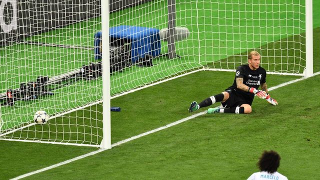 TOPSHOT - Liverpool's German goalkeeper Loris Karius sits in front of his goal after a shot by Real Madrid's Benzema (not in picture) was not given due to offside during the UEFA Champions League final football match between Liverpool and Real Madrid at the Olympic Stadium in Kiev, Ukraine on May 26, 2018.