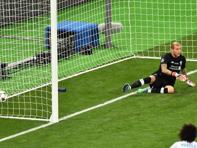 TOPSHOT - Liverpool's German goalkeeper Loris Karius sits in front of his goal after a shot by Real Madrid's Benzema (not in picture) was not given due to offside during the UEFA Champions League final football match between Liverpool and Real Madrid at the Olympic Stadium in Kiev, Ukraine on May 26, 2018.