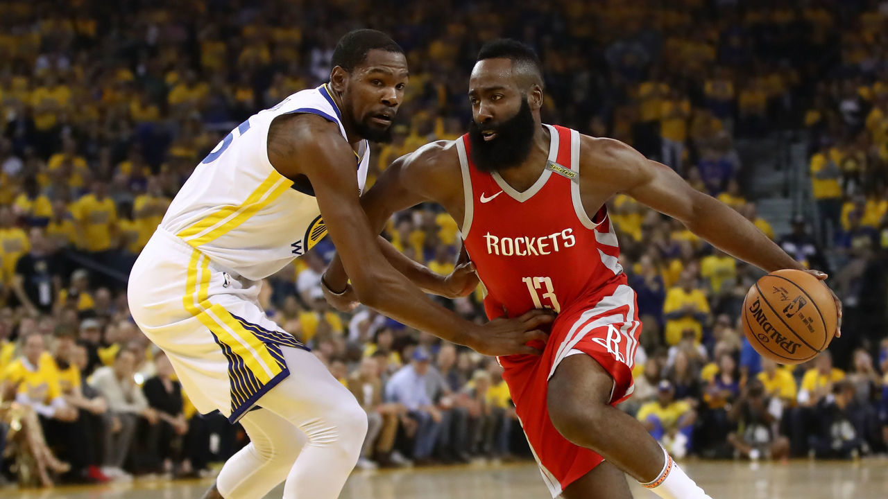 OAKLAND, CA - MAY 26: James Harden #13 of the Houston Rockets drives with the ball against Kevin Durant #35 of the Golden State Warriors during Game Six of the Western Conference Finals in the 2018 NBA Playoffs at ORACLE Arena on May 26, 2018 in Oakland, California.