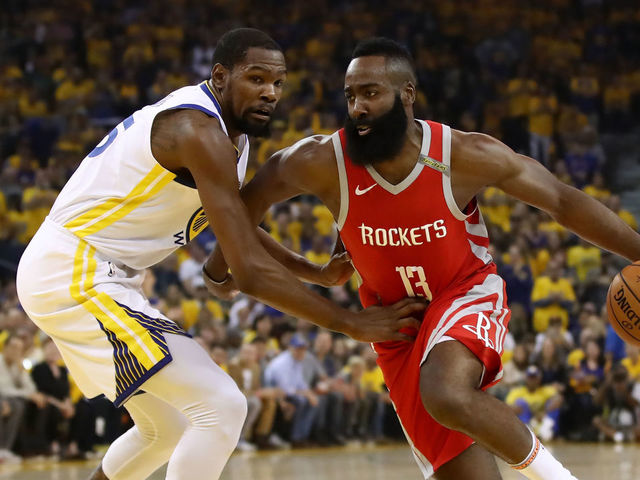 OAKLAND, CA - MAY 26: James Harden #13 of the Houston Rockets drives with the ball against Kevin Durant #35 of the Golden State Warriors during Game Six of the Western Conference Finals in the 2018 NBA Playoffs at ORACLE Arena on May 26, 2018 in Oakland, California.