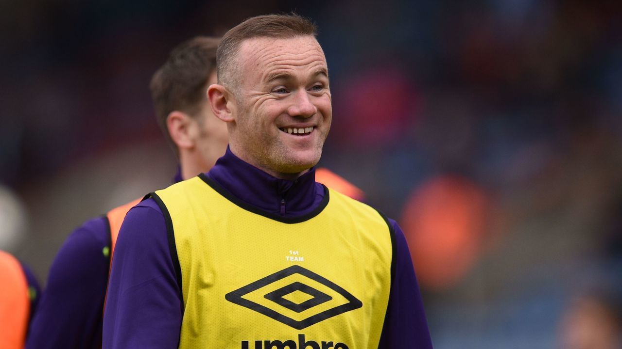Everton's English striker Wayne Rooney smiles as he warm up ahead of the English Premier League football match between Huddersfield Town and Everton at the John Smith's stadium in Huddersfield, northern England on April 28, 2018.
